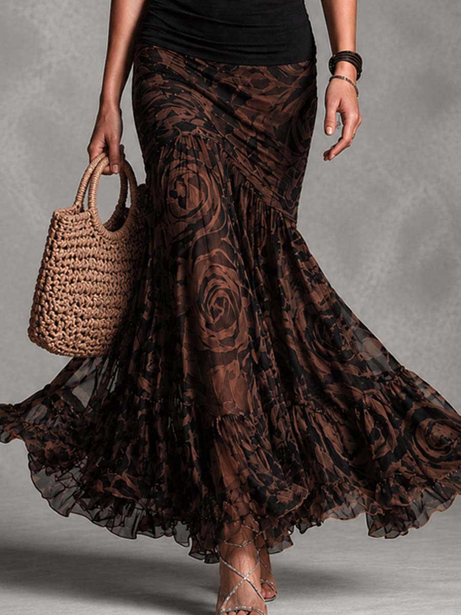 SET RÉTRO CON TOP NERO CON SPALLINE E GONNA IN RETE MARRONE STAMPATA