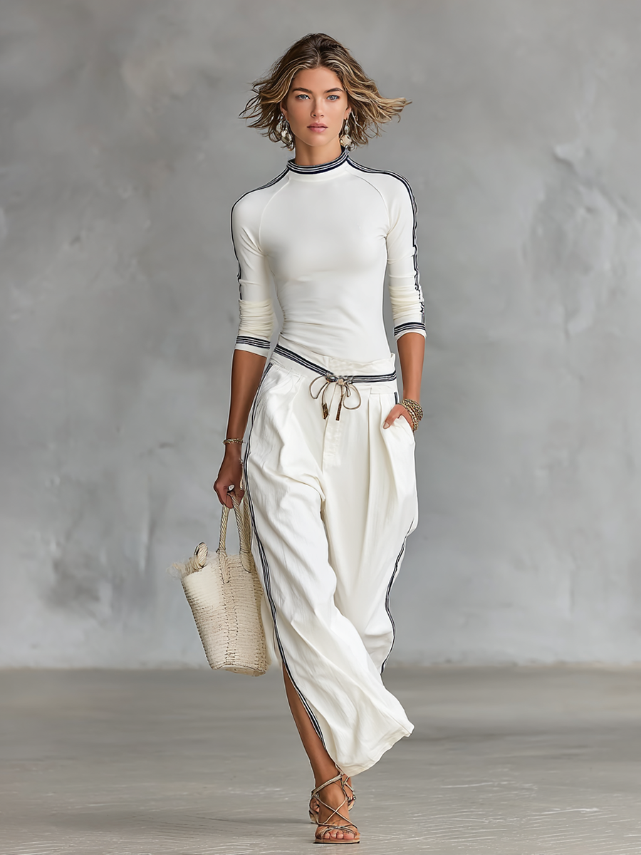 COMPLETO DA DONNA: T-SHIRT SPORTIVA A MANICHE LUNGHE CON COLLO ALTO E PANTALONI LARGHI CON COULISSE
