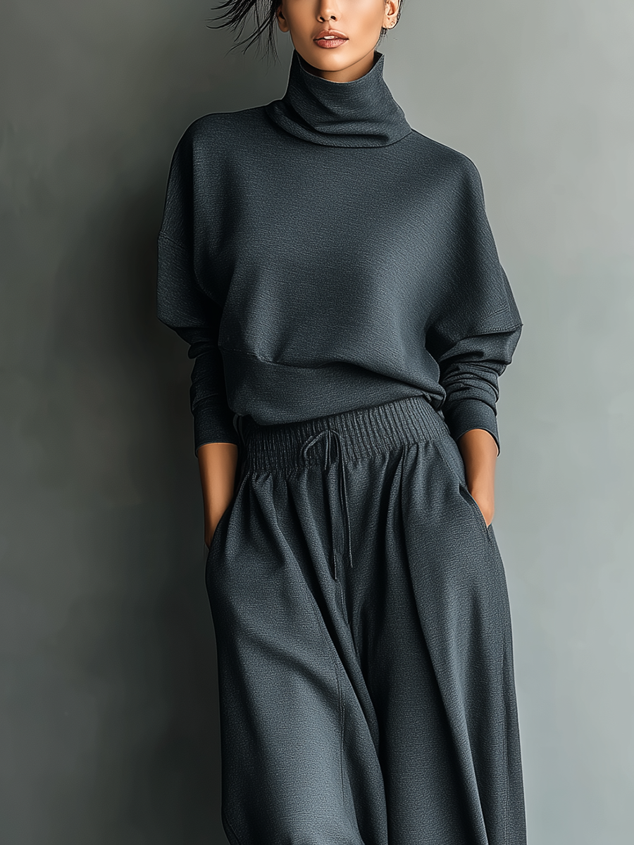 COMPLETO DONNA IN MAGLIA COLOR CARBONE CON COLLO ALTO E PANTALONI A PALAZZO