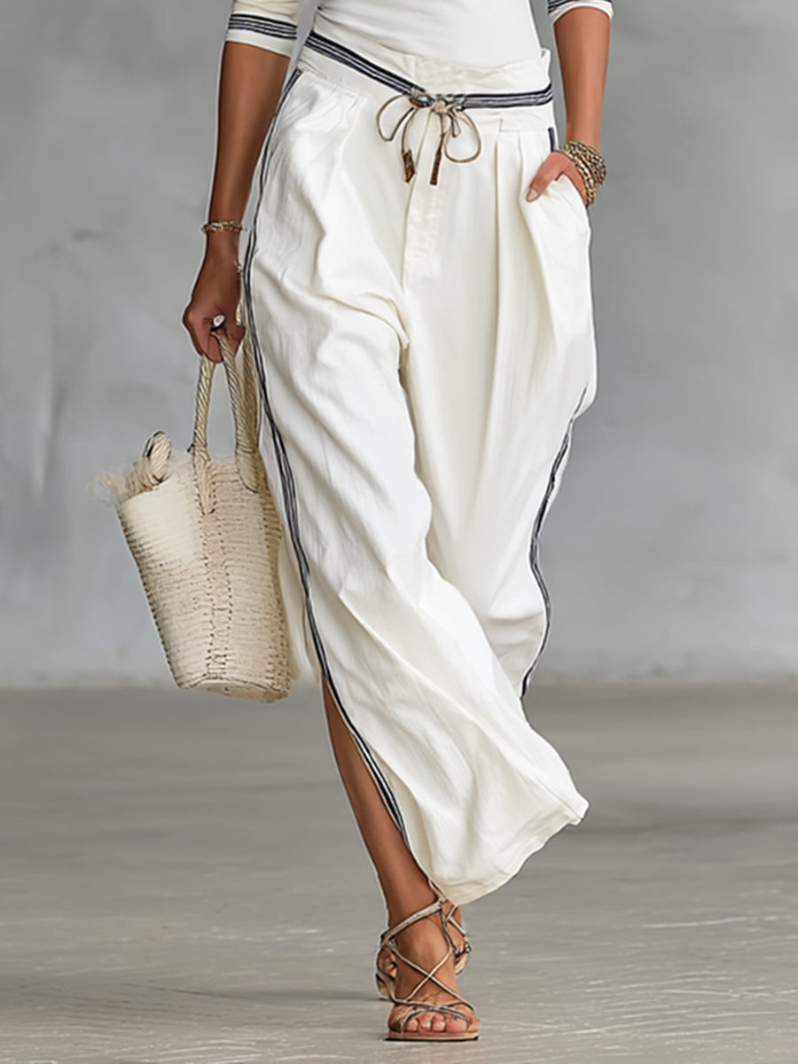 SET DUE PEZZI DA DONNA: T-SHIRT SPORTIVA A MANICHE LUNGHE CON COLLO A MEZZO ALTO E PANTALONI LARGHI CON COULISSE