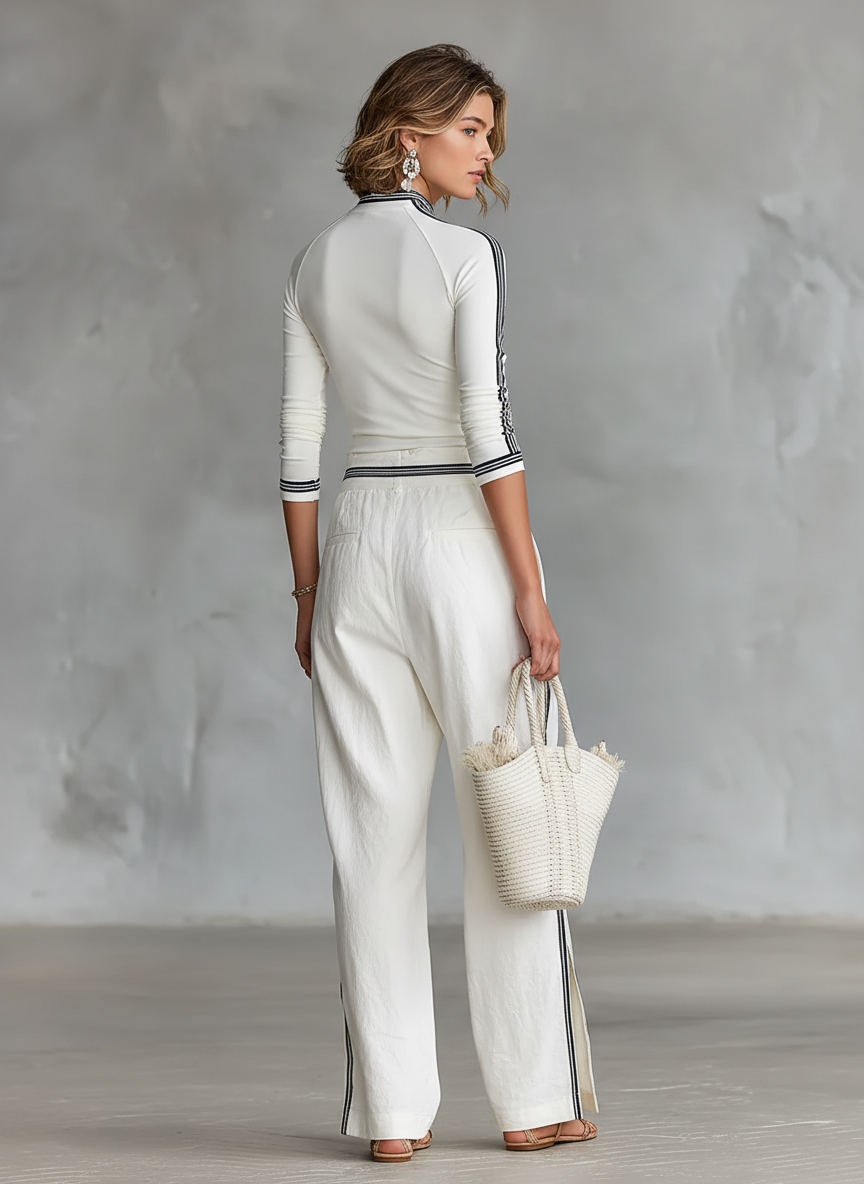 COMPLETO DA DONNA: T-SHIRT SPORTIVA A MANICHE LUNGHE CON COLLO ALTO E PANTALONI LARGHI CON COULISSE