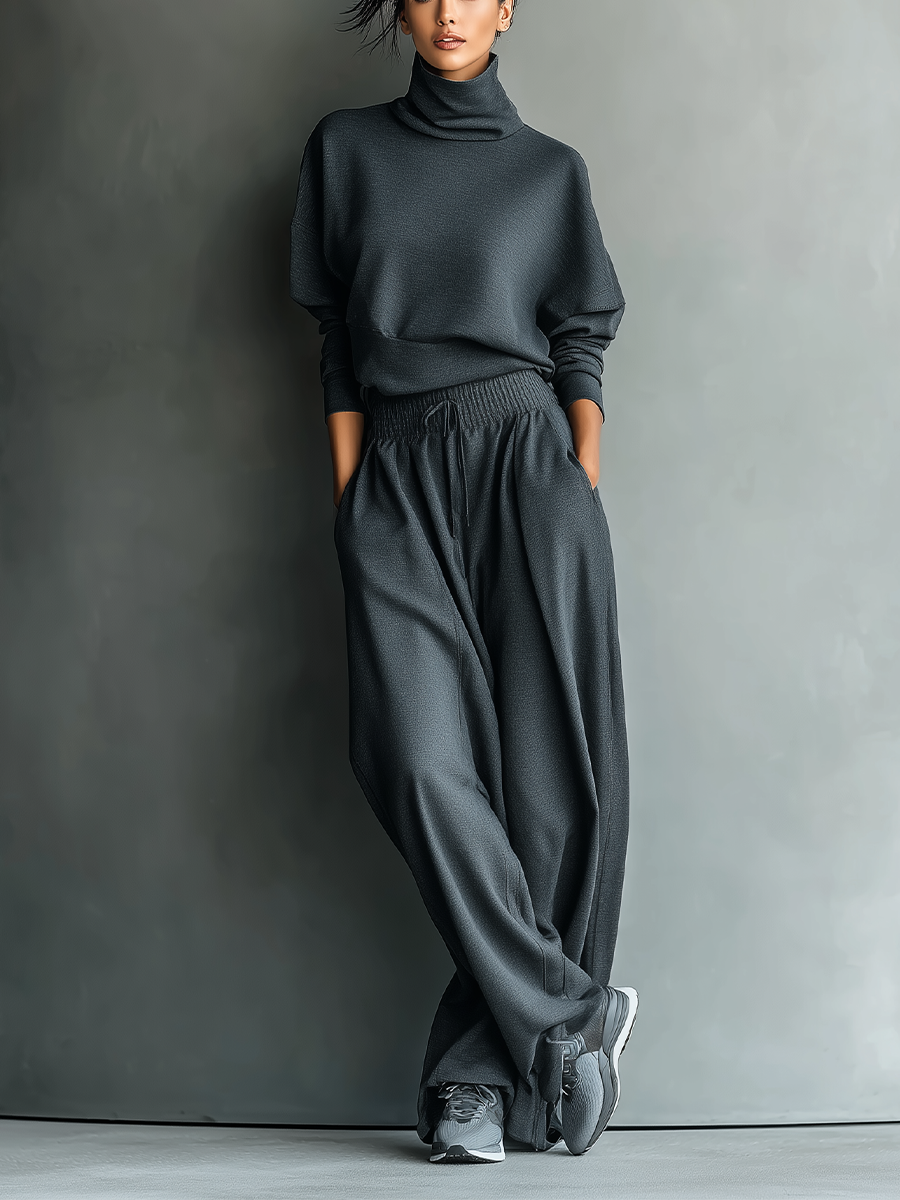 COMPLETO DONNA IN MAGLIA COLOR CARBONE CON COLLO ALTO E PANTALONI A PALAZZO